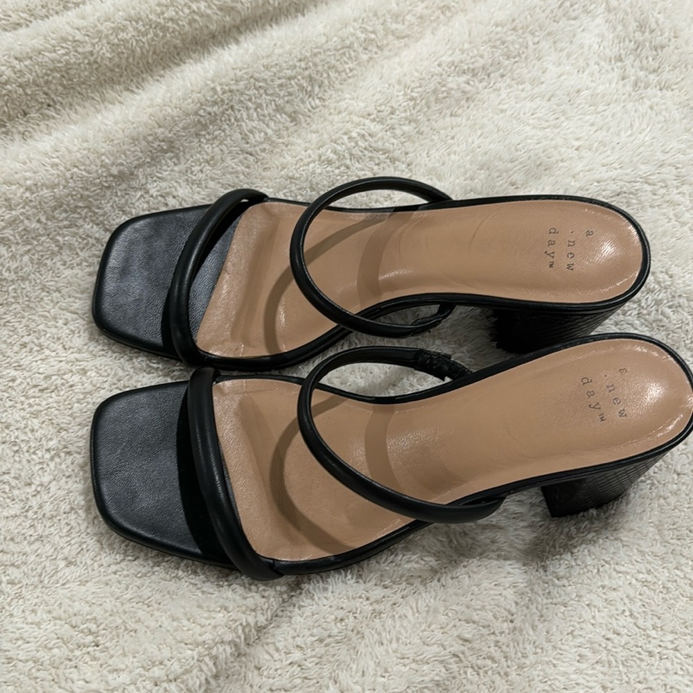 Women’s black size 8 strappy heels.
